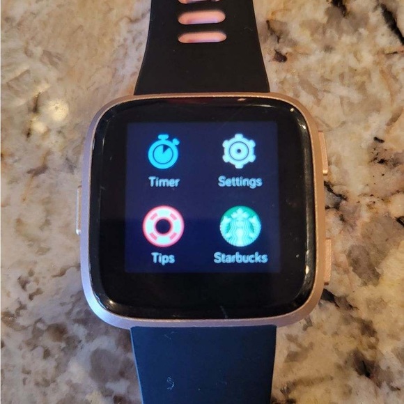 Veres Fitbit including charger and several watchbands. Updated software. - Picture 2 of 7